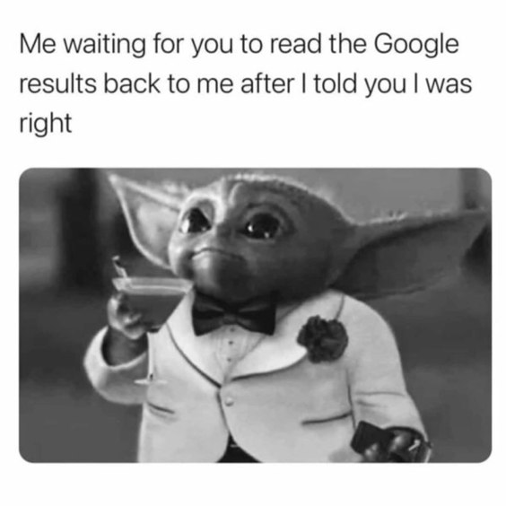 A black and white photo of Baby Yoda (Grogu) dressed in a tuxedo and holding a martini glass, looking smug.