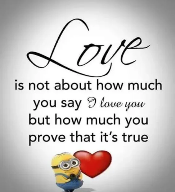 An inspirational romantic quote reading 'Love is not about how much you say I love you but how much you prove that it's true' in elegant cursive and sans-serif fonts above a Minion standing next to a big red heart. Love Is How Much You Prove It's True Minion Quote