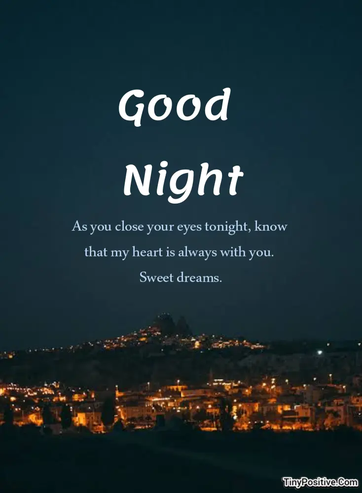 A good night quote card reading 'Good Night As you close your eyes tonight, know that my heart is always with you. Sweet dreams.' set against a dark night landscape with glowing city lights.