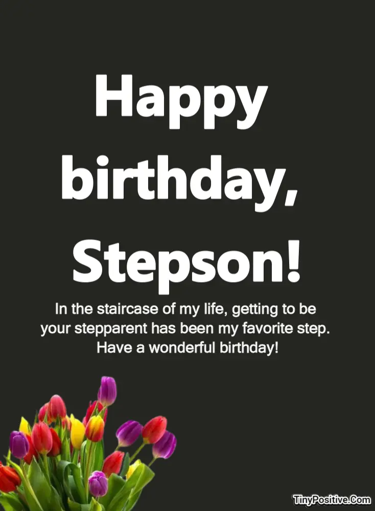 A dark charcoal grey birthday card featuring bold white text reading Happy birthday, Stepson! above a sweet message and a colorful bouquet of tulips in the bottom left corner, with the TinyPositive.Com watermark at the bottom right.