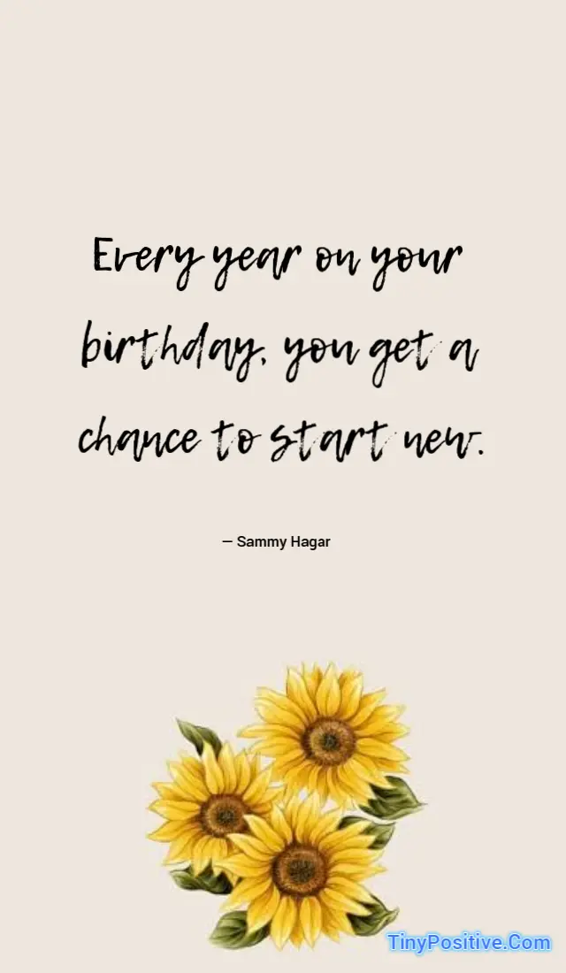 An inspirational birthday quote graphic set against a plain light beige background. In the upper center, black handwritten-style script text reads: Every year on your birthday, you get a chance to start new. Below the quote, the attribution reads: — Sammy Hagar. At the bottom, a cluster of vibrant yellow sunflowers with green leaves is displayed, alongside the TinyPositive.Com watermark in blue text at the lower right corner.
